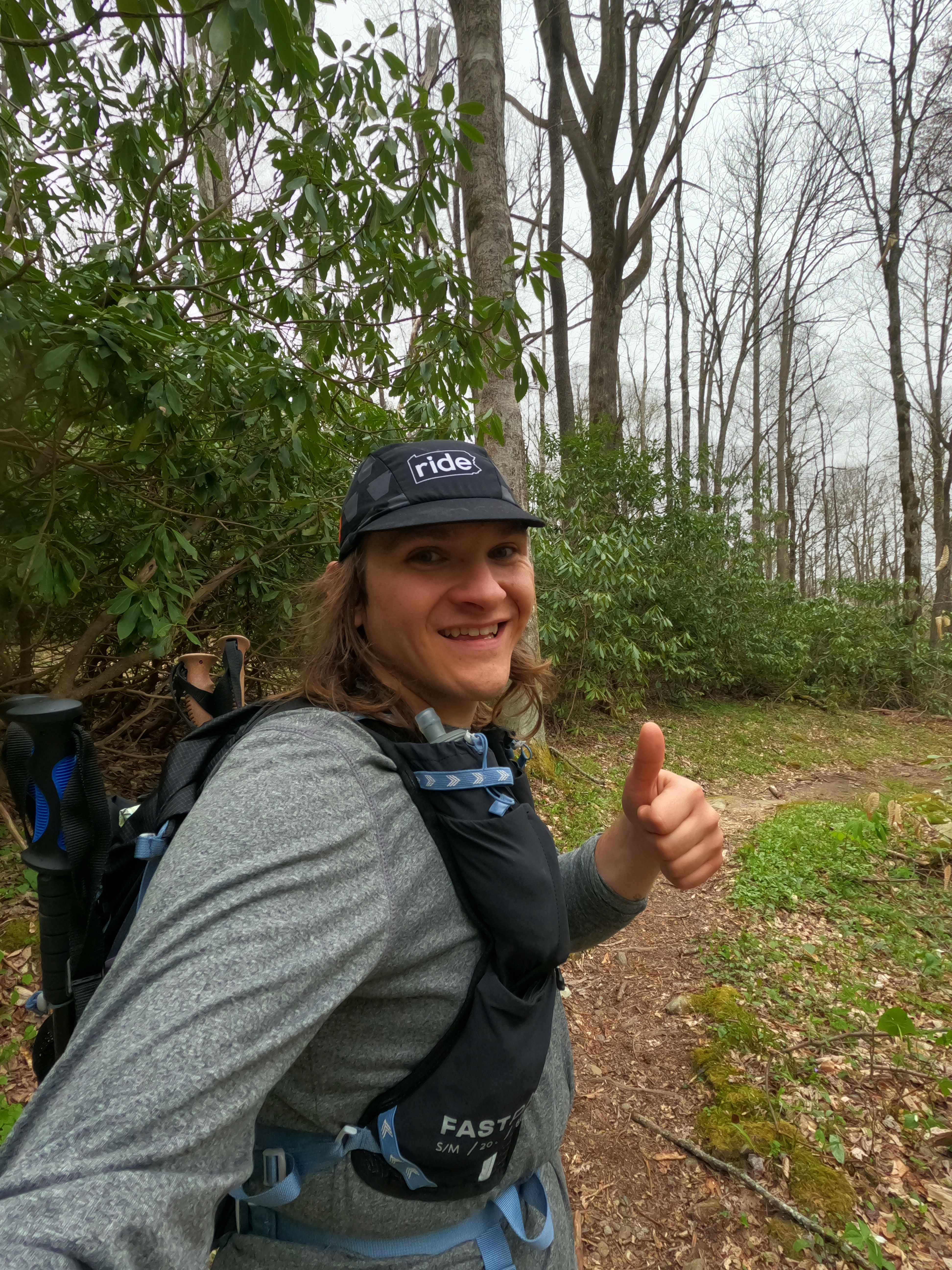 Photo of Brett in running gear giving the thumbs up